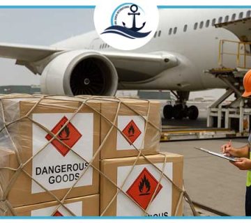 Dangerous goods cargo being inspected and loaded onto a cargo airplane at Dubai Airport under strict safety compliance.