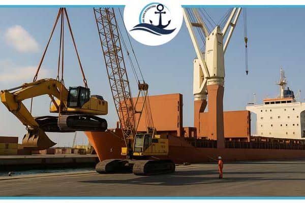 Break bulk cargo operation at Jebel Ali Port showing a crane lifting a large yellow excavator onto a cargo vessel under clear blue skies.